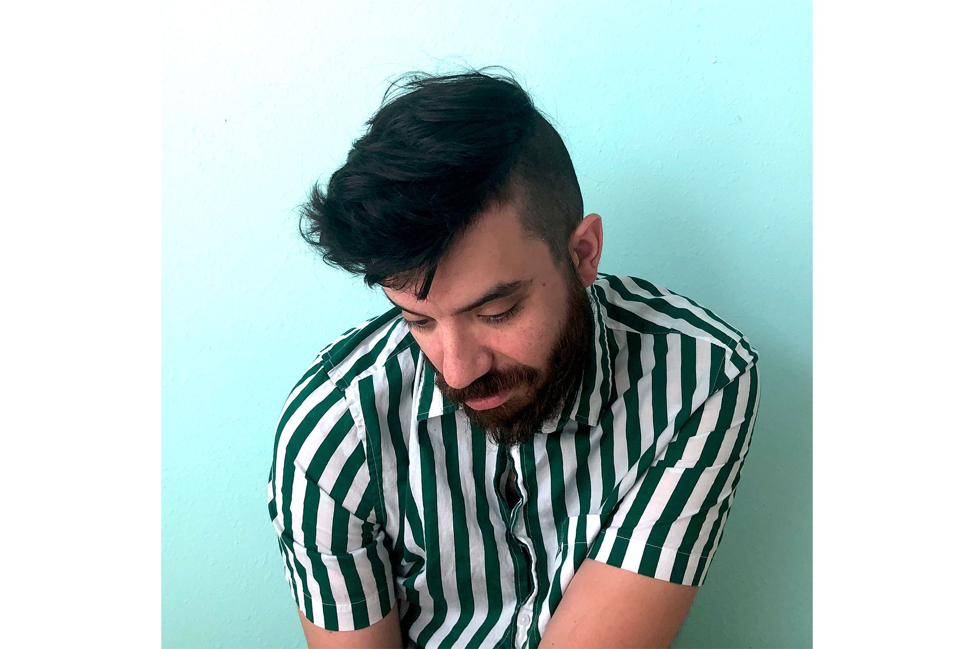 Headshot of poet Kaveh Akbar