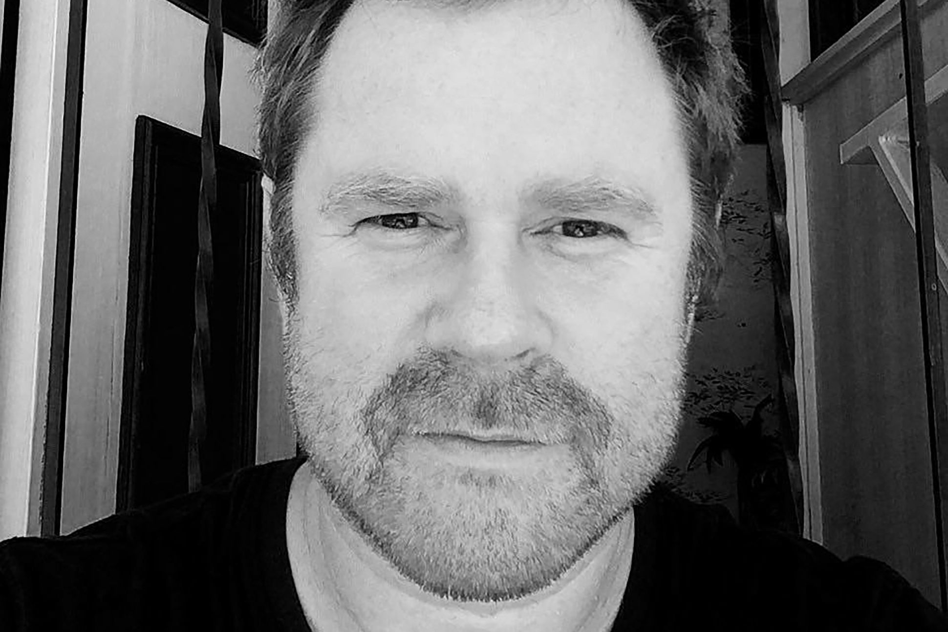 black and white closeup photo of poet Stuart Barnes