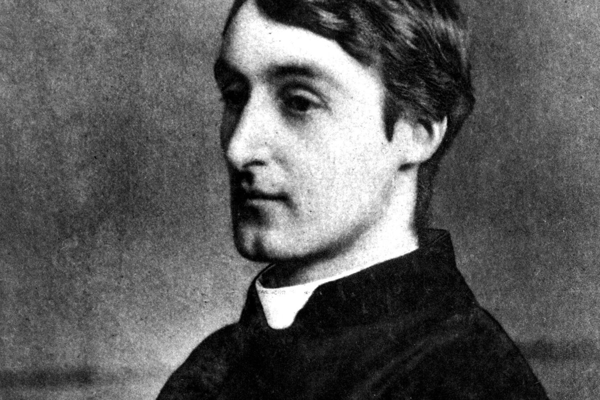 Tight-cropped, black and white, side profile of Gerard Manley Hopkins.