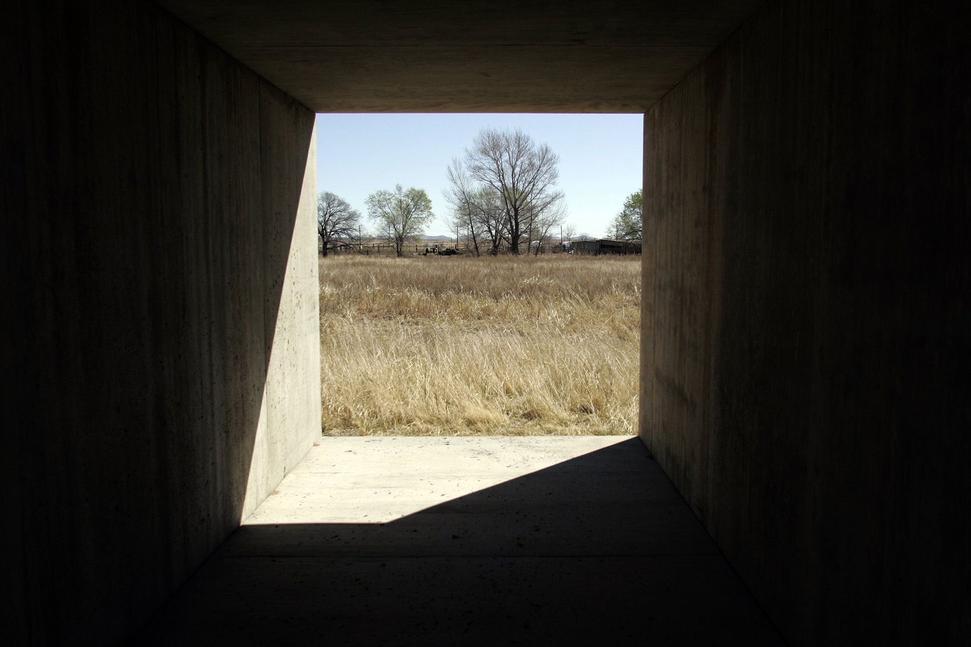 Image of the landscape of Marfa, Texas, from inside one of Donald Judd's concrete artworks.
