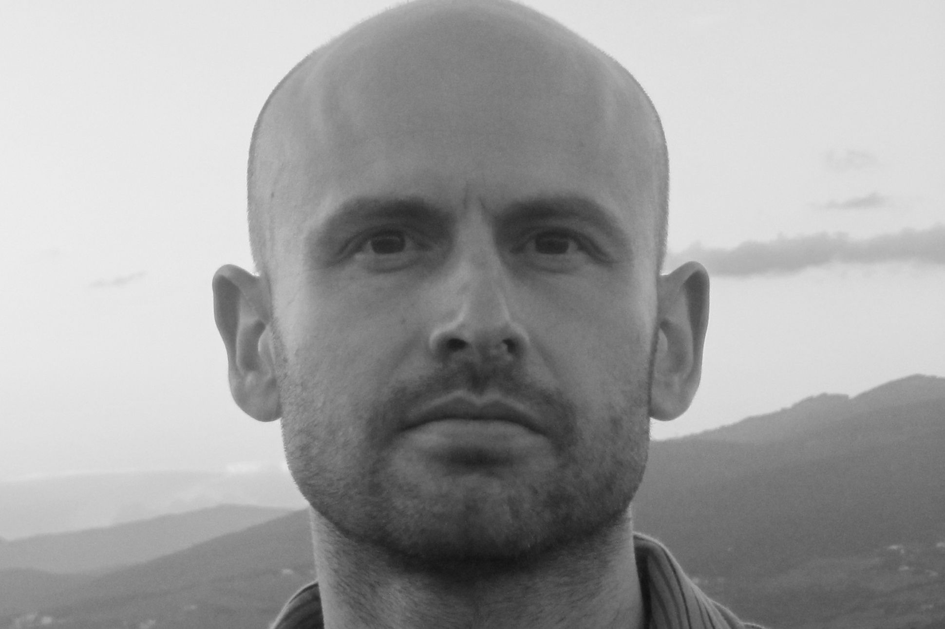 Black and white close up photograph of Matthew Bevis