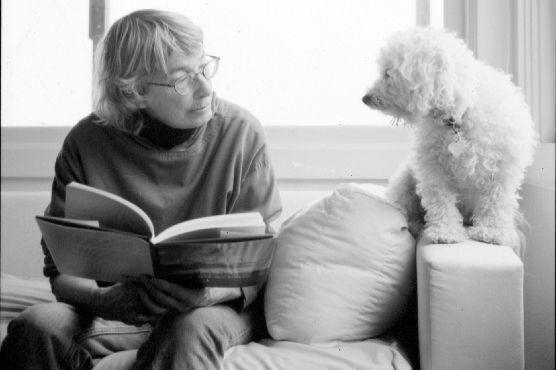 Image of Mary Oliver with her dog.