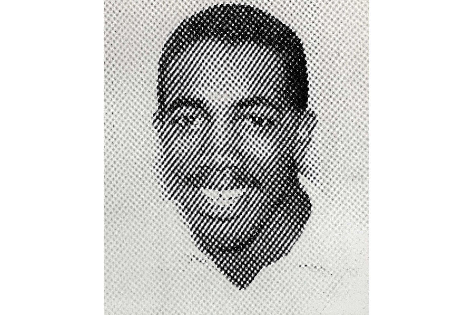 Black and white portrait of a smiling Henry Dumas