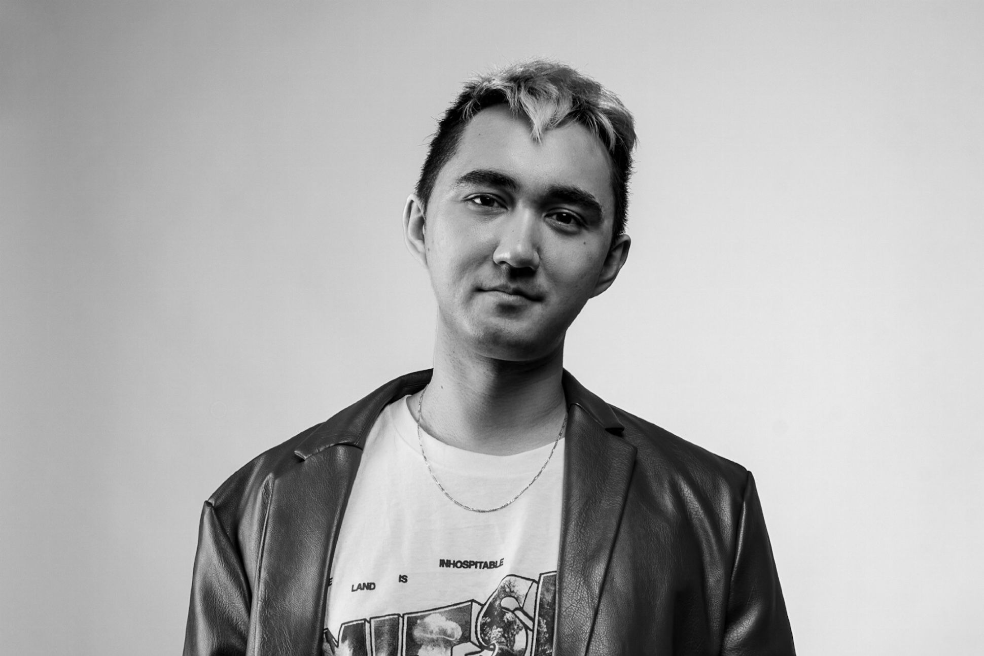 The poet Rob Macaisa. Colgate wearing an oversized brown pleather blazer and a Mitski t-shirt, quietly
excited, thinking about poems.