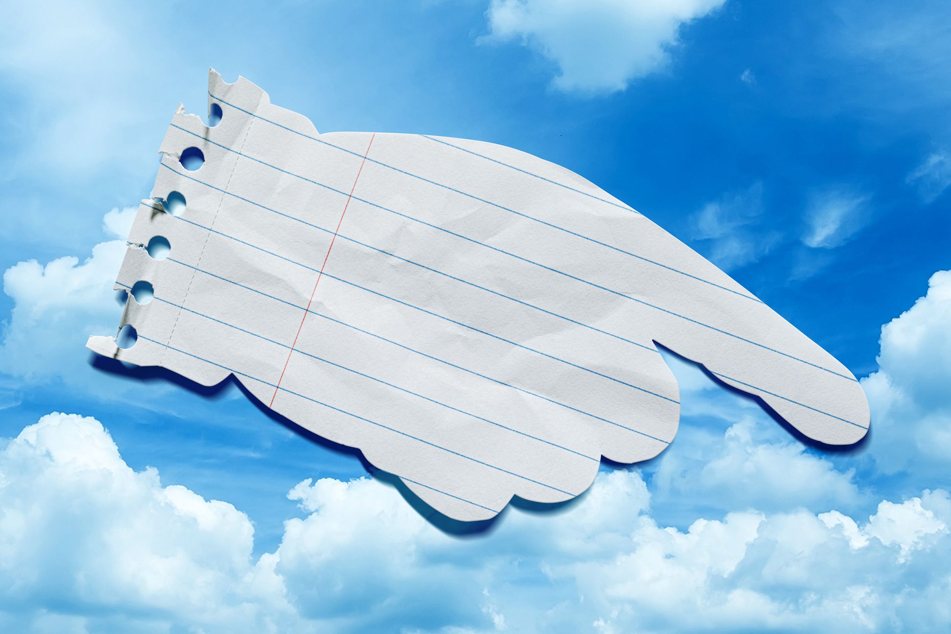 A large pointing hand, made out of notebook paper, is juxtaposed against a blue sky.