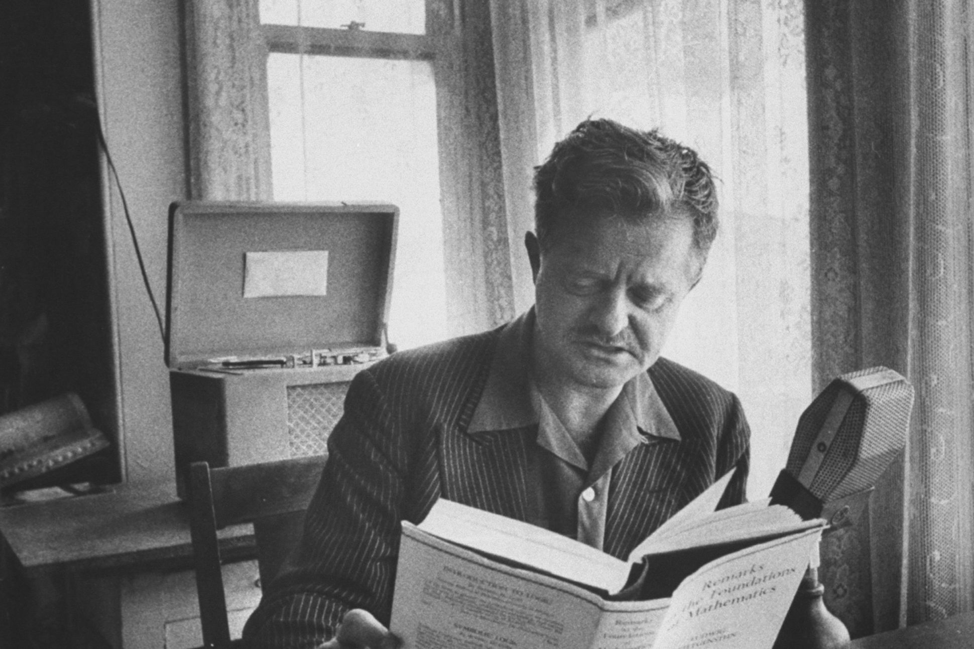 Poet Kenneth Rexroth reading a book. (Photo by Nat Farbman/The LIFE Picture Collection via Getty Images)