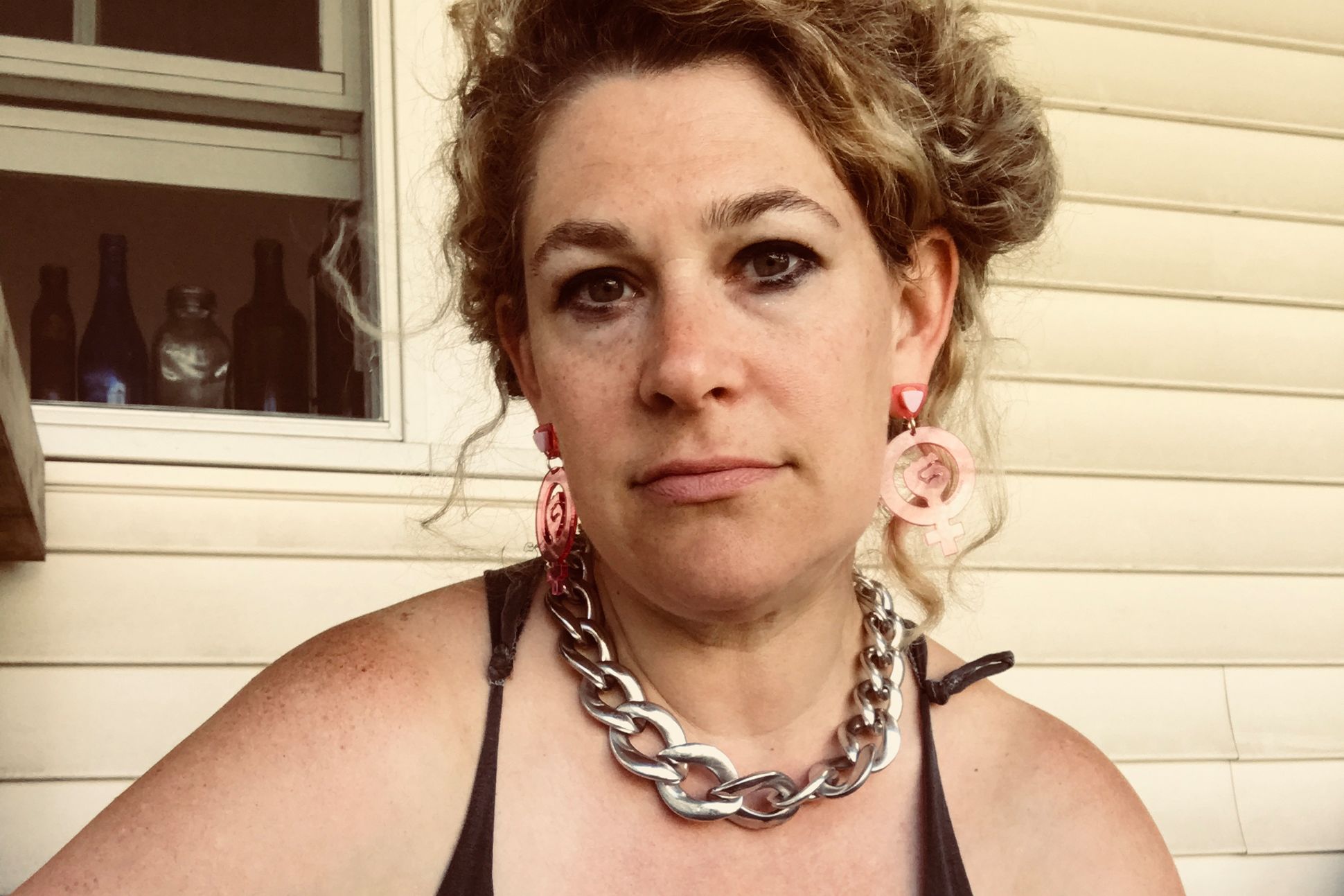 Portrait of Arielle Greenberg sitting outside.
