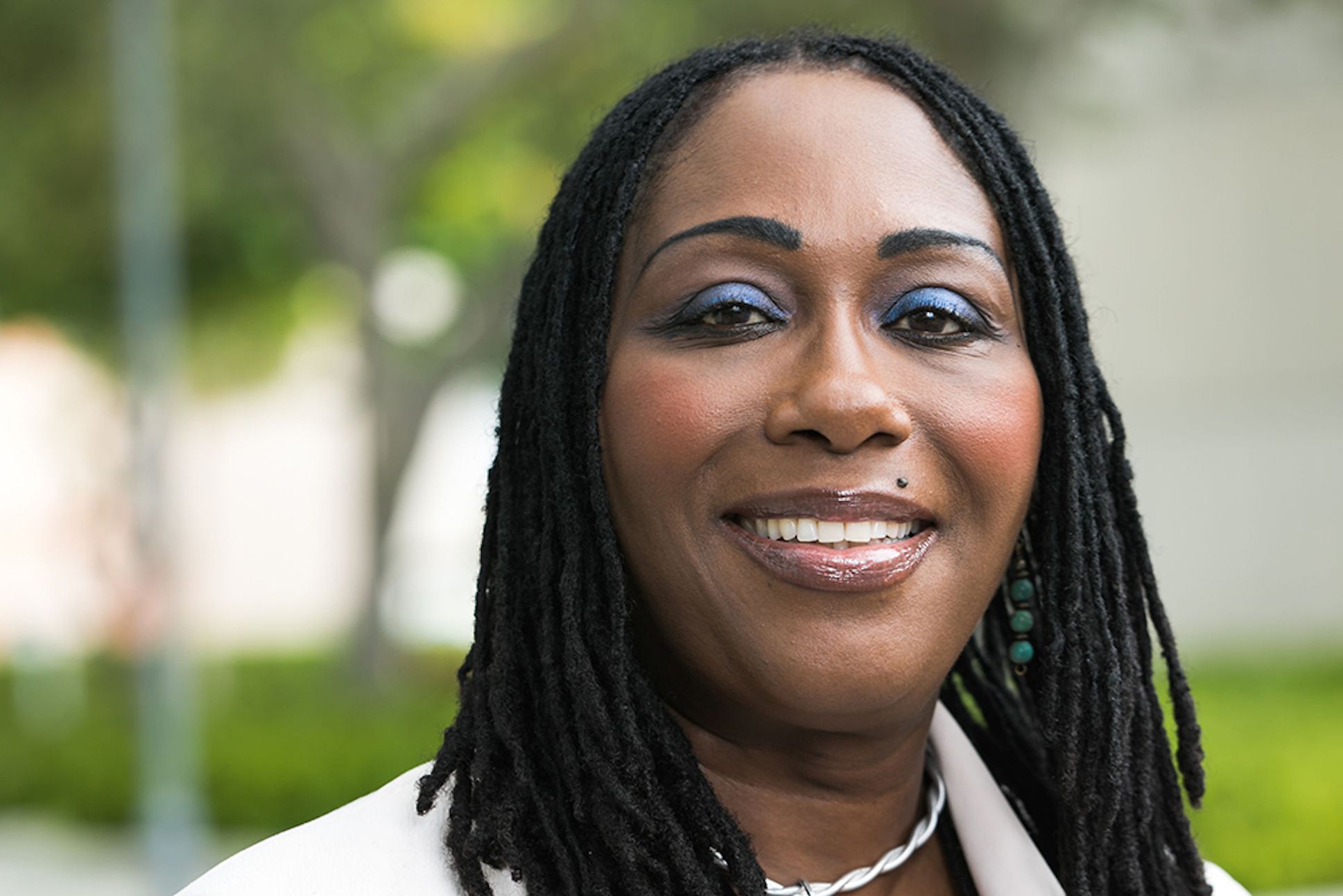 A black woman in braided hair