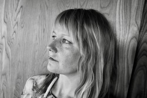 Black and white photo of poet Sandra Doller