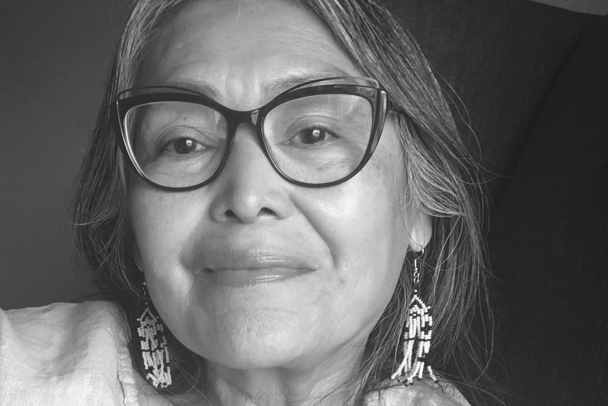 Woman with a cat-eye-shaped glasses