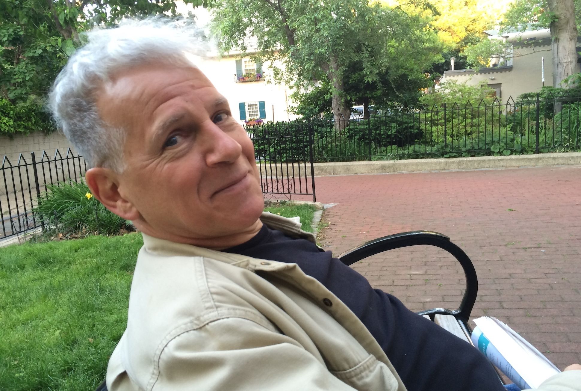 Headshot of Jim Cory sitting on a park bench.