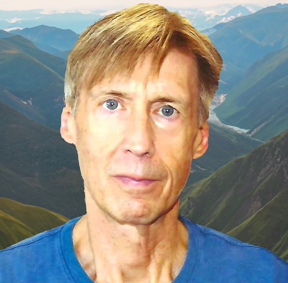 Joe Amato in front of mountain
landscape