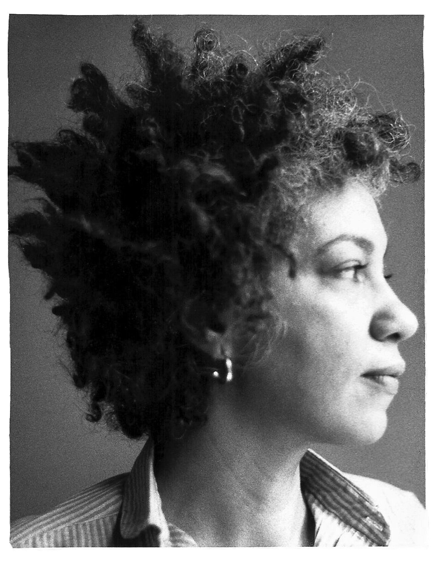 Black and white photo of June Jordan in profile looking stoic.